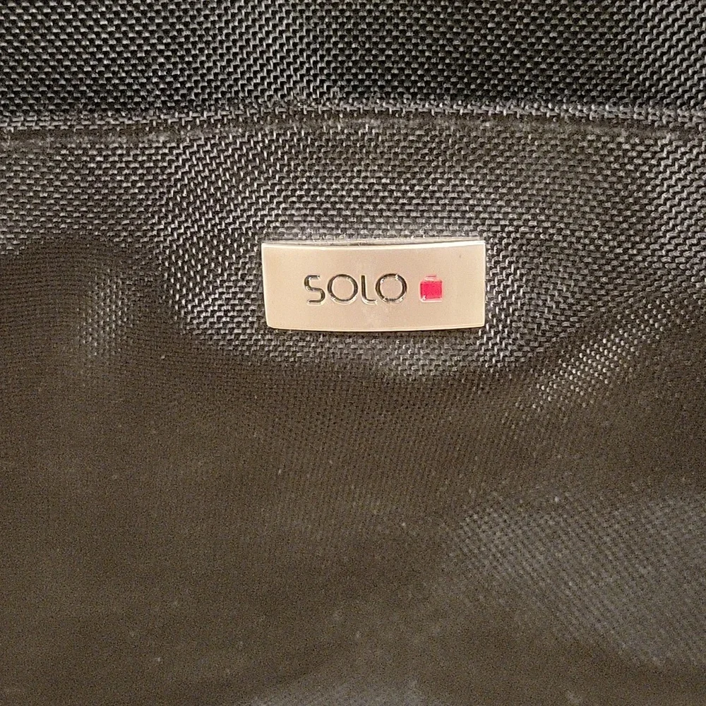 Solo black briefcase with a pullout sleeve for your laptop in black.